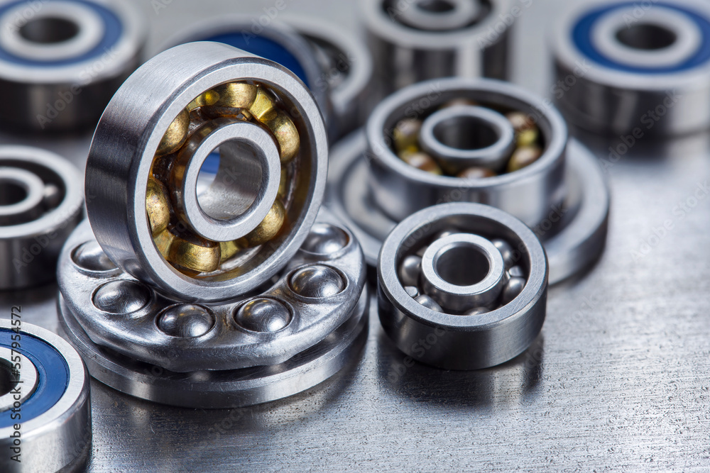 different bearings on a metal background. Part of mechanism. different bearings on a metal background. Part of mechanism.
