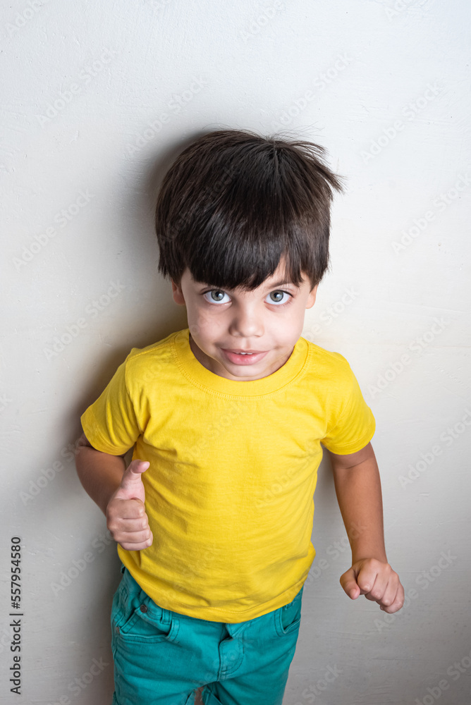 Cute and happy boy with yellow t-shirt Cute and happy boy with yellow t-shirt
