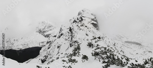 Panoram w Tarach Polskich w zimie z duża ilością śniegu. Widok u podnóża Kościelca z  Czarnym Stawem Gąsiennicowym i Doliną Gąsiennicową photo