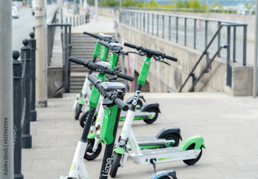 Foto de A group of Lime electric scooters on the street, efficient eco