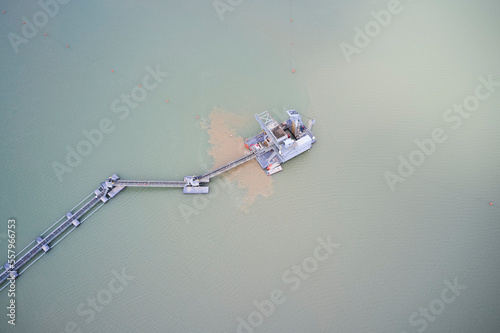 Εκτύπωση καμβά A sand dredger floating in the water at a sandpit.