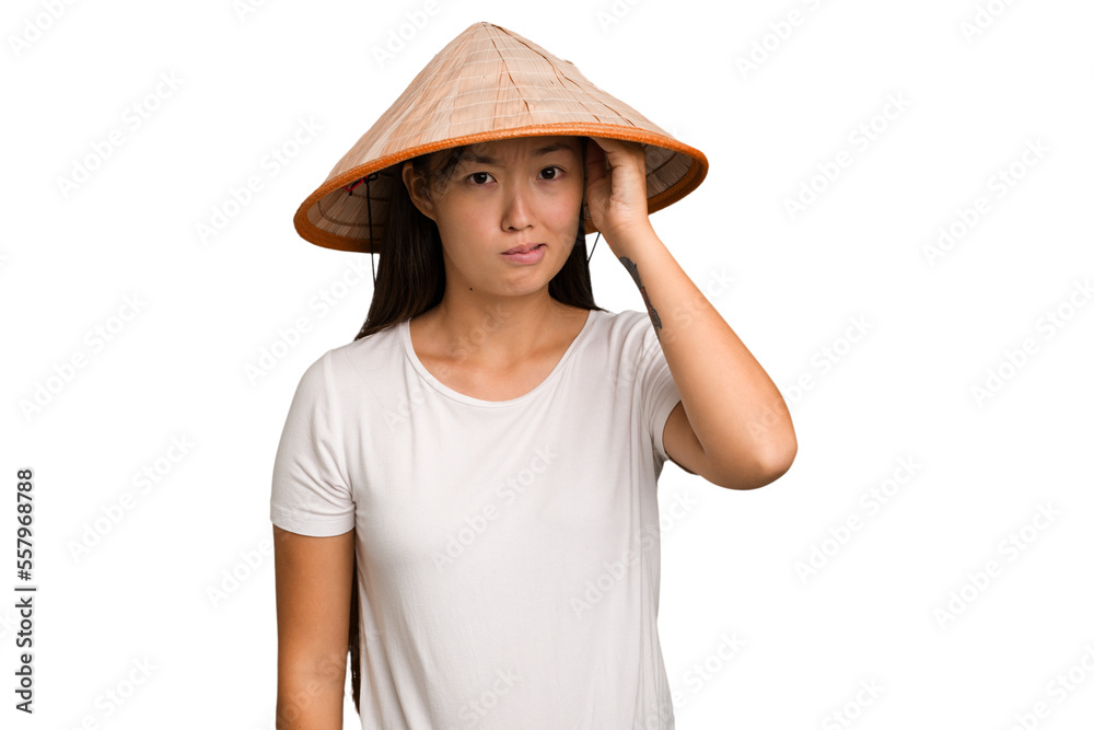 Young asian woman wearing a Vietnamese hat isolated being shocked, she has remembered important meeting. Young asian woman wearing a Vietnamese hat isolated being shocked, she has remembered important meeting.