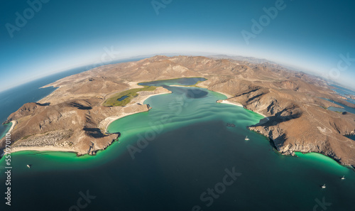 Panoramic view of Balandra beach with mountains in the background on a sunny day in La Paz, Baja California Sur, Mexico
