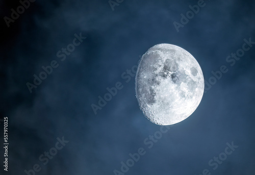 Moon on the cloudy sky close up