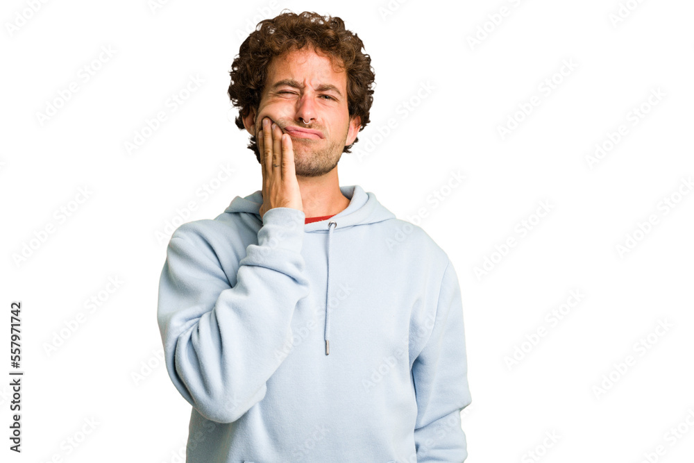 Young curly smart caucasian man cut out isolated having a strong teeth pain, molar ache.