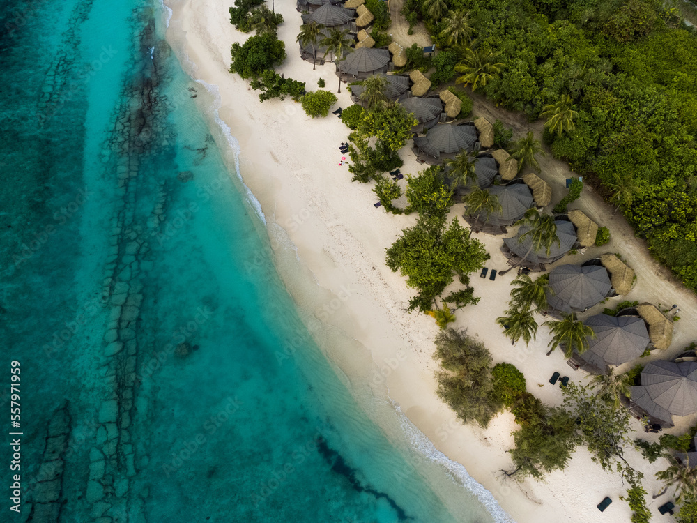 Aerial photo of beautiful paradise Maldives tropical beach on island.