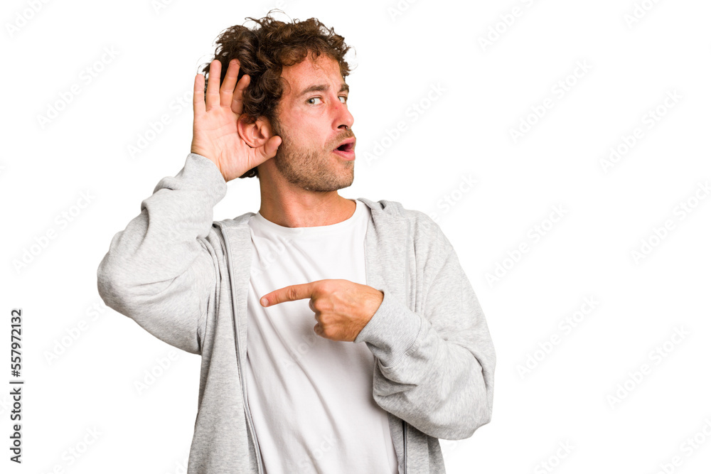 Young curly smart caucasian man cut out isolated trying to listening a gossip. Young curly smart caucasian man cut out isolated trying to listening a gossip.