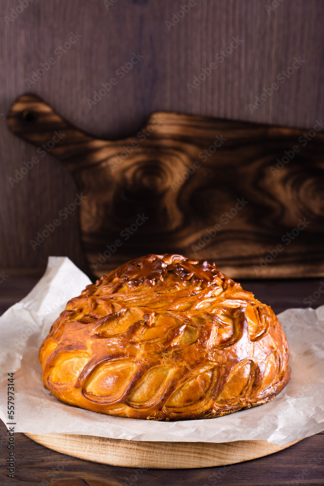 Traditional savory pie kurnik with chicken, potatoes and rice. Homemade  baking. Vertical view Stock Photo