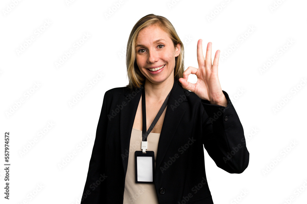 Young caucasian business woman with ID card isolated cheerful and confident showing ok gesture. Young caucasian business woman with ID card isolated cheerful and confident showing ok gesture.