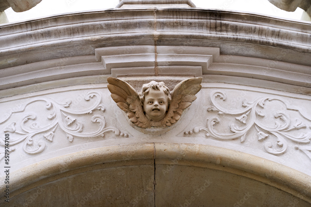 Angel head with wings scupture, an old architecture detail in Wroclaw