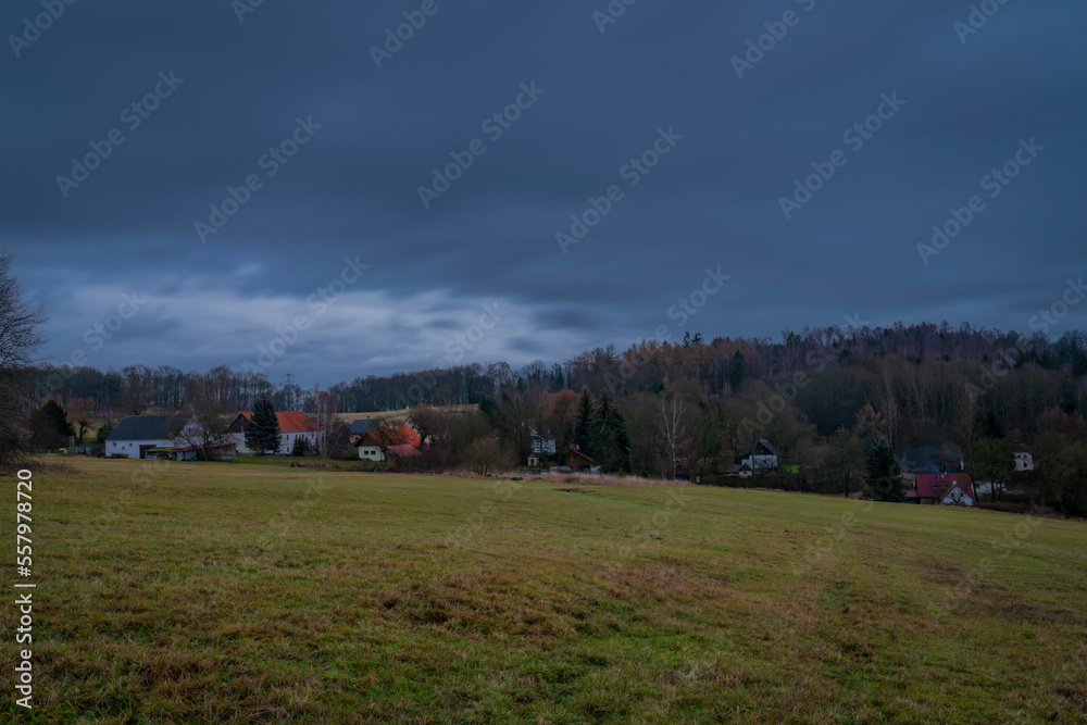 Field near Nemci small village in Ceske Stredohori mountains in winter day Field near Nemci small village in Ceske Stredohori mountains in winter day