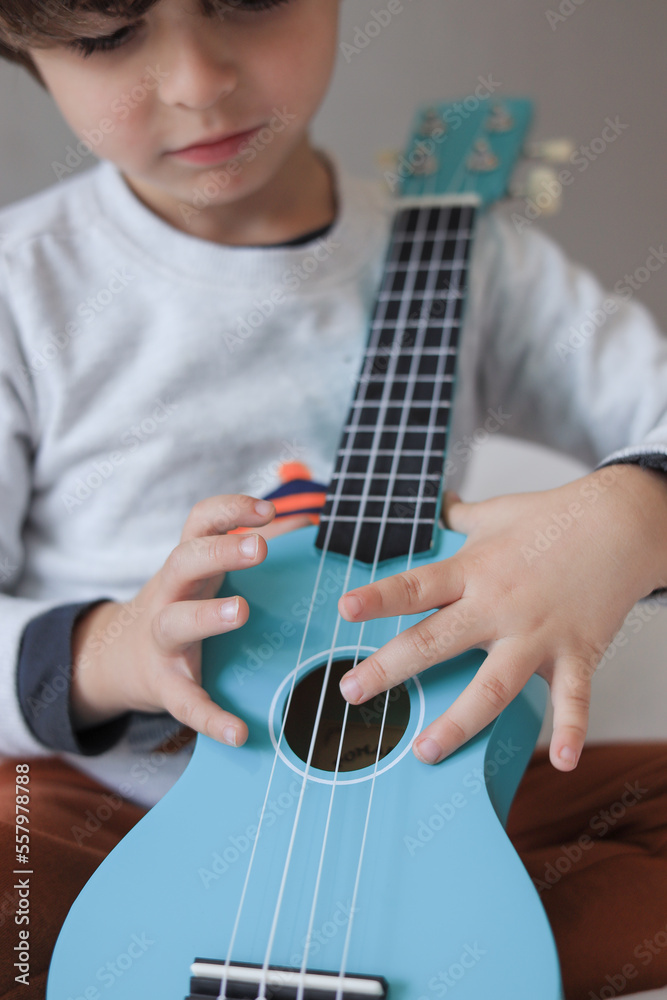 Fototapeta premium blue Ukuleles child playing 