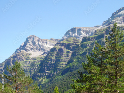 mountainous landscape of the Spanish Pyrenees. lots of green vegetation and high mountains.
