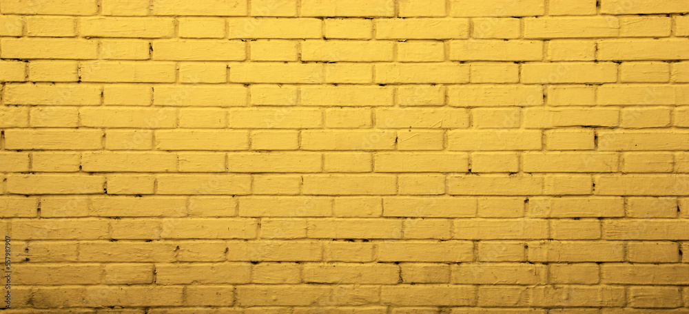 Obraz premium Yellow street brick wall background or texture