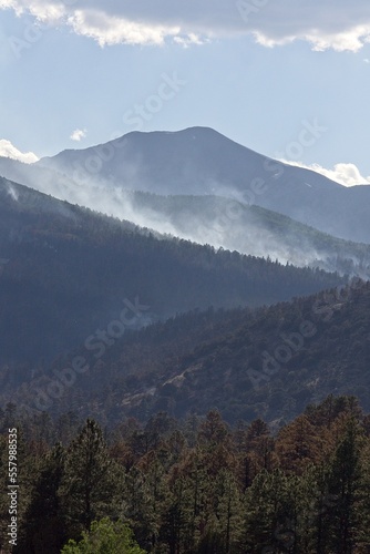 Smoke rising in the mountains in the Schultz Fire near Flagstaff, Arizona. photo