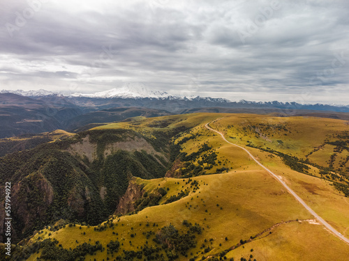 Car Moving among Green Hills and Forest. photo