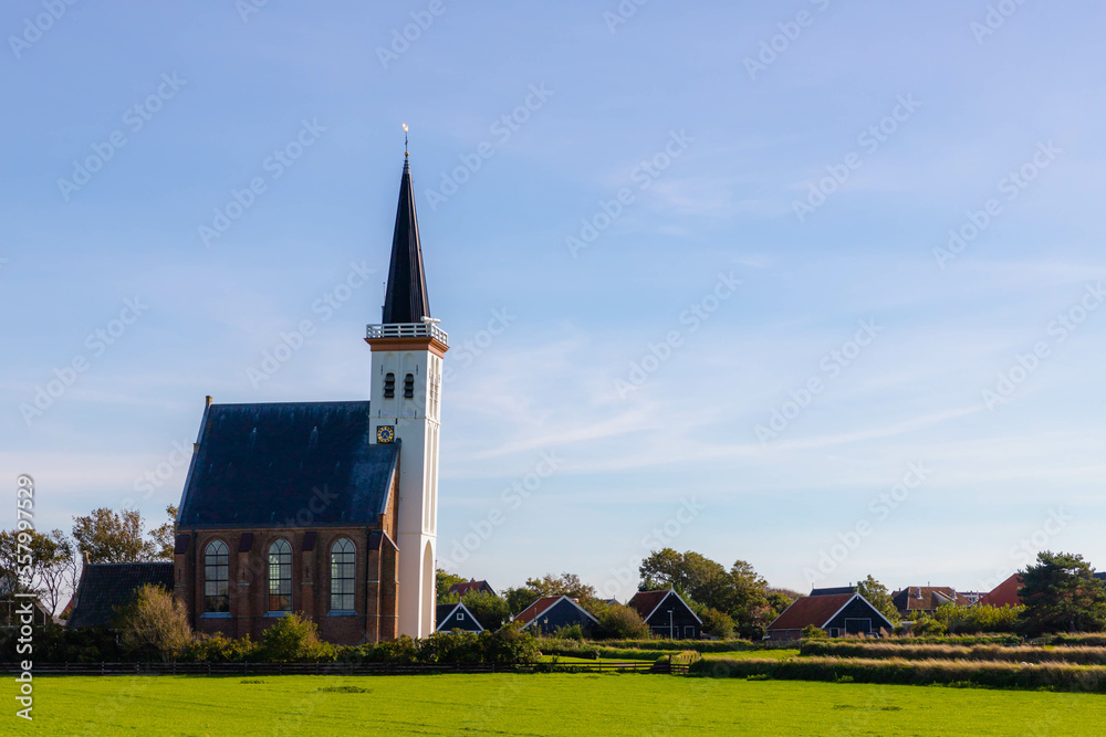 Typical landscape of Texel island, Small village and picturesque church