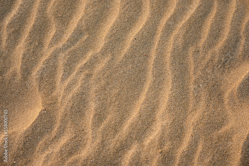 Sand in the desert with a pattern from the wind as a background.