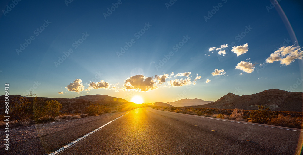 Empty long nevada mountain road to the horizon on a sunny summer day at bright sunset - obrazy, fototapety, plakaty 
