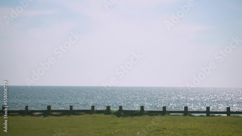 Slow motion video of a calm ocean during a bright and sunny day