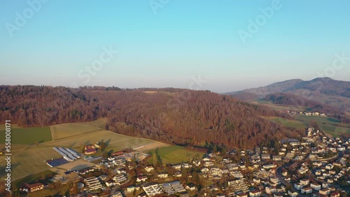 Great flight over the roofs of a small village with about 8000 inhabitants on a beautiful autumn evening in 4K.