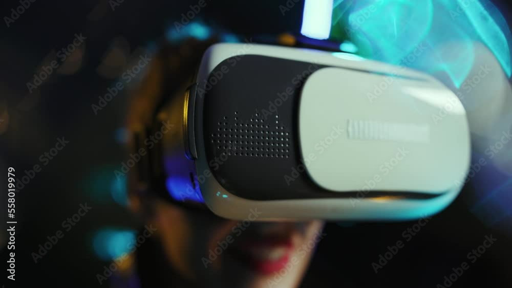 Closeup on happy middle aged woman in metaverse in vr goggles. Closeup on happy middle aged woman in metaverse in vr goggles.