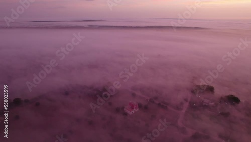 Puglia province covered in mist during stunning colorful sunrise, aerial photo