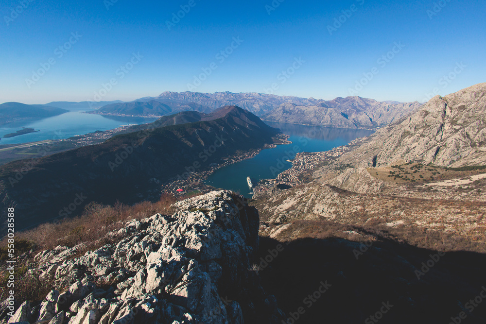 The Bay of Kotor, Beautiful aerial view of Boka Kotorska, with Kotor, Herceg Novi and Tivat municipalities in a sunny day, Adriatic sea and Dinaric Alps with Lovcen and Orjen mountains, Montenegro The Bay of Kotor, Beautiful aerial view of Boka Kotorska, with Kotor, Herceg Novi and Tivat municipalities in a sunny day, Adriatic sea and Dinaric Alps with Lovcen and Orjen mountains, Montenegro