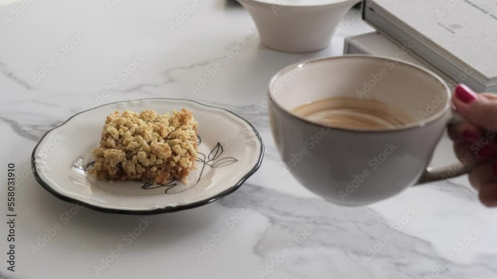 Drinking coffee with milk next to Apple Pie desert Drinking coffee with milk next to Apple Pie desert