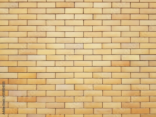 Yellow brick wall background. With copy space. 