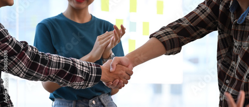 Cropped image business people shaking hands for successful agreement or after meeting in office