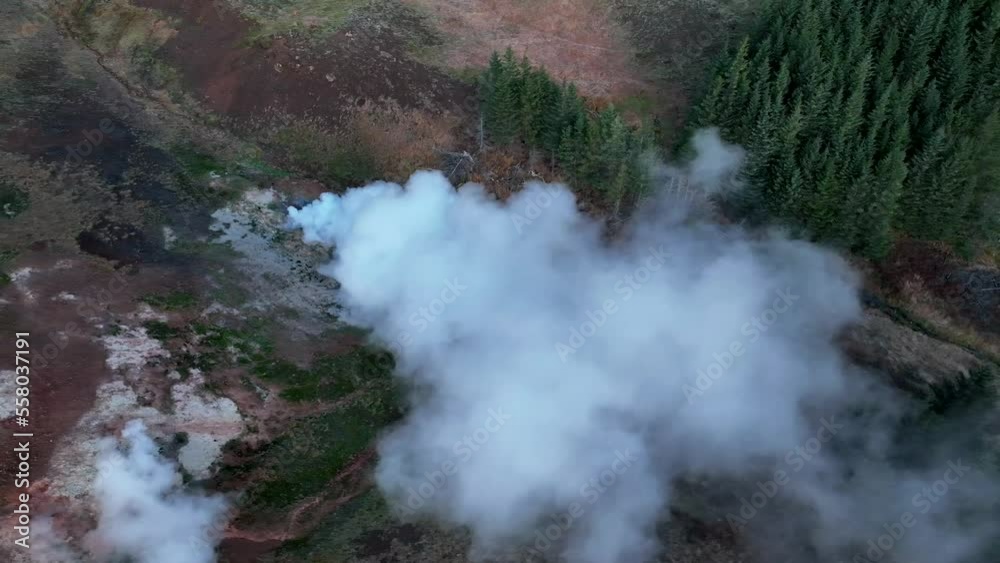Steaming Hot Spring In Geothermal Landscape Of Hverir In South Iceland. aerial sideways Steaming Hot Spring In Geothermal Landscape Of Hverir In South Iceland. aerial sideways