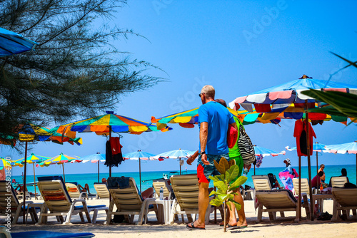 Man walking on the beach in Phuket, Thailand, Beautiful tropical beach in Thailand © ดวงหทัย สิทธิเนตรสกุ