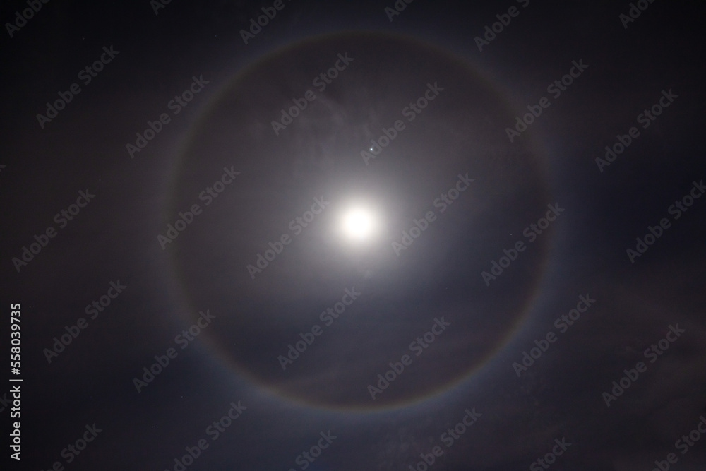 Beautiful Moon Ring , Beautiful winter Halo around the Moon with night sky.