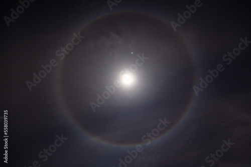 Beautiful Moon Ring , Beautiful winter Halo around the Moon with night sky.