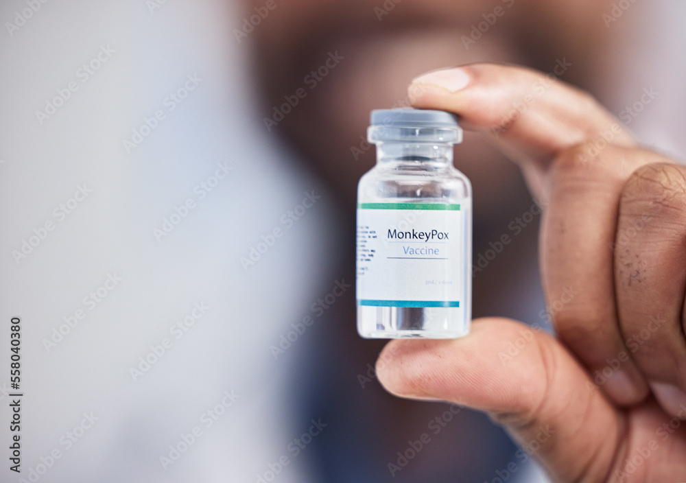 Monkeypox vaccine, healthcare and hands of doctor nurse with medicine bottle, vial or booster for disease protection. Hospital science lab, pharmacist or pharmacy black man with medical virus support Monkeypox vaccine, healthcare and hands of doctor nurse with medicine bottle, vial or booster for disease protection. Hospital science lab, pharmacist or pharmacy black man with medical virus support