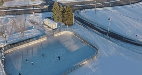 Kids Playing Ice Hockey At Richardson Park In Champlin Minnesota - Drone Shot photo