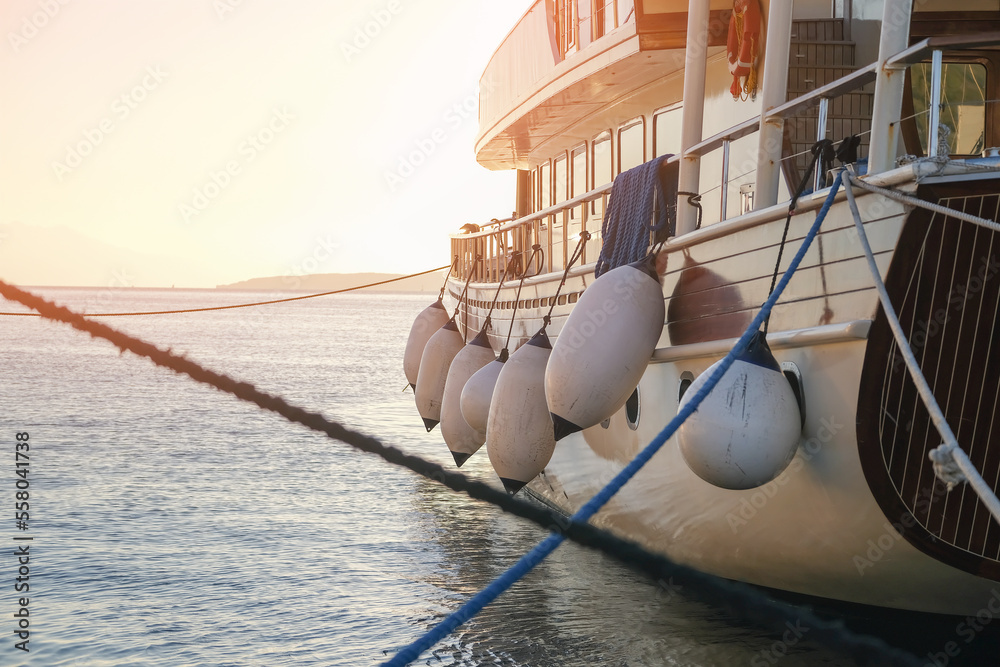Mooring buoys on fenders of yacht in harbour, boat fenders balls Stock