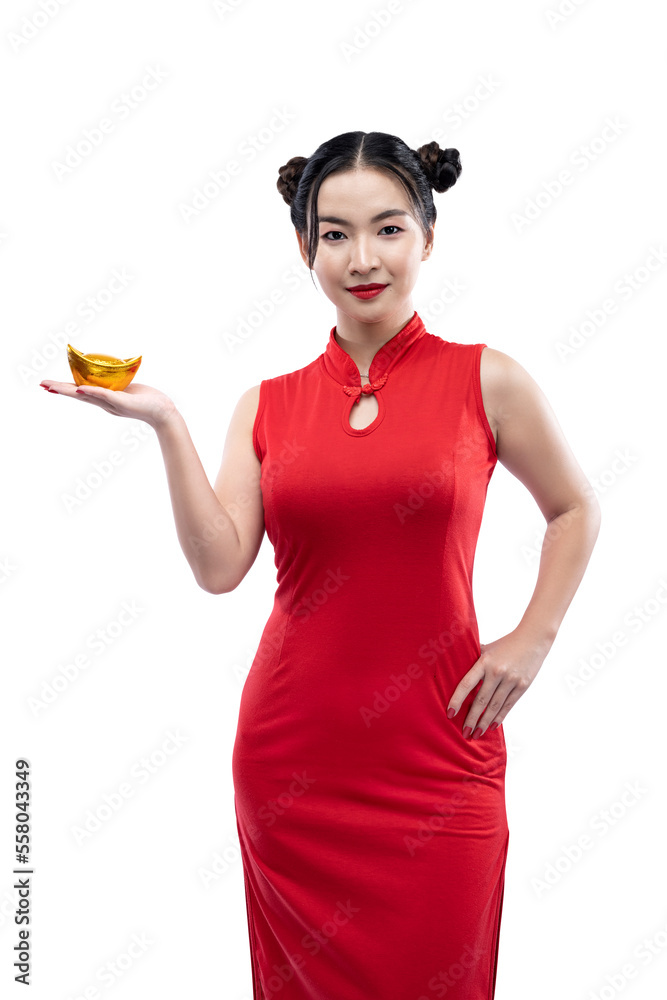 Asian Chinese woman in a cheongsam dress holding a Chinese gold ingot Asian Chinese woman in a cheongsam dress holding a Chinese gold ingot