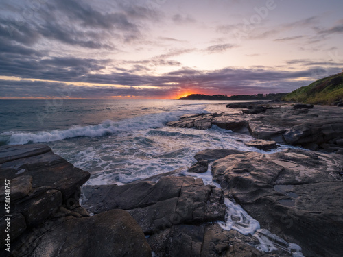 Coastal Sunrise with Waves Crashing