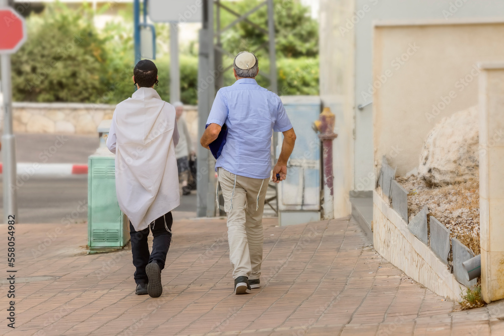 Two men go to the synagogue on Shabbat