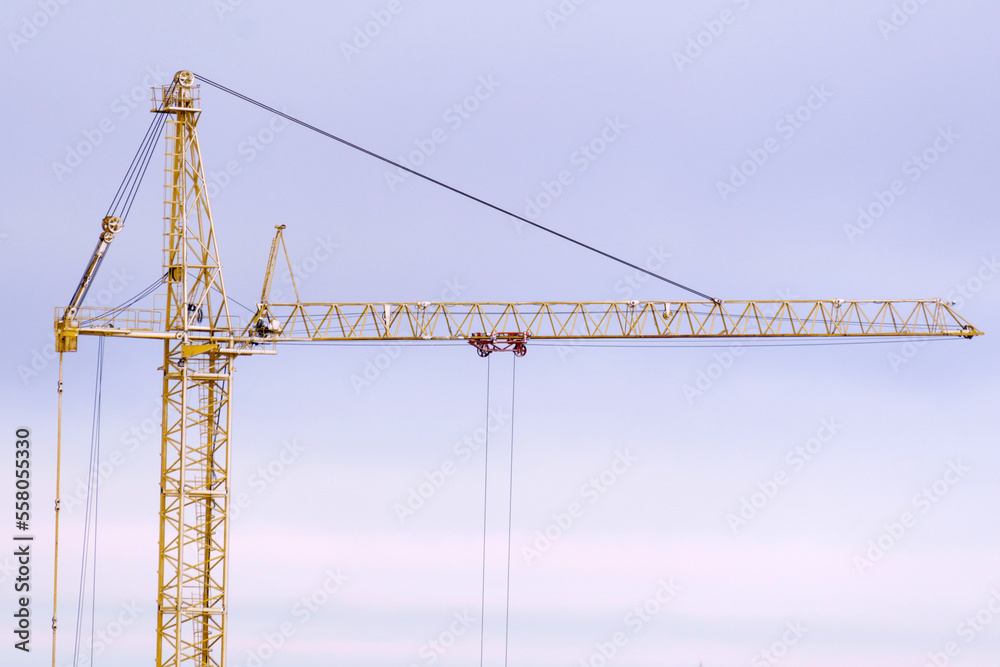 Construction crane close-up. Global communications, economy, business, industry, supply, special. Copy space Construction crane close-up. Global communications, economy, business, industry, supply, special. Copy space