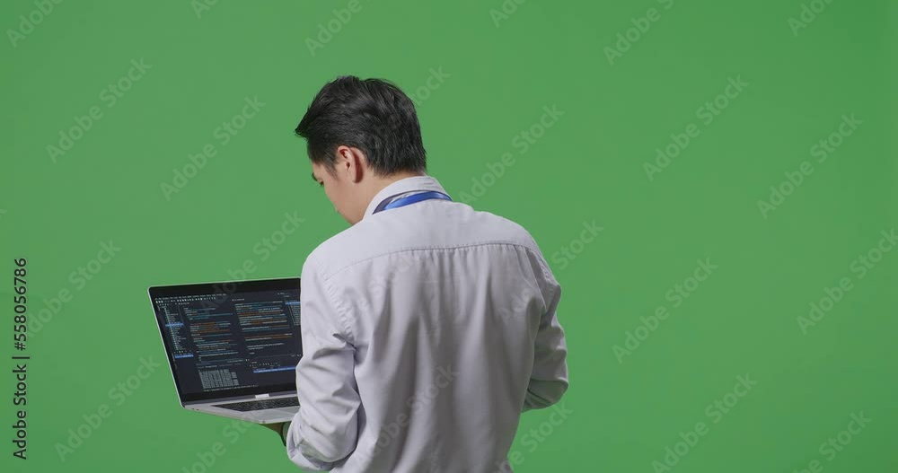 Back View Of Asian Business Man Using Laptop Computer On Green Screen Background In The Studio, Computer Display Showing Code
Back View Of Asian Business Man Using Laptop Computer On Green Screen Background In The Studio, Computer Display Showing Code