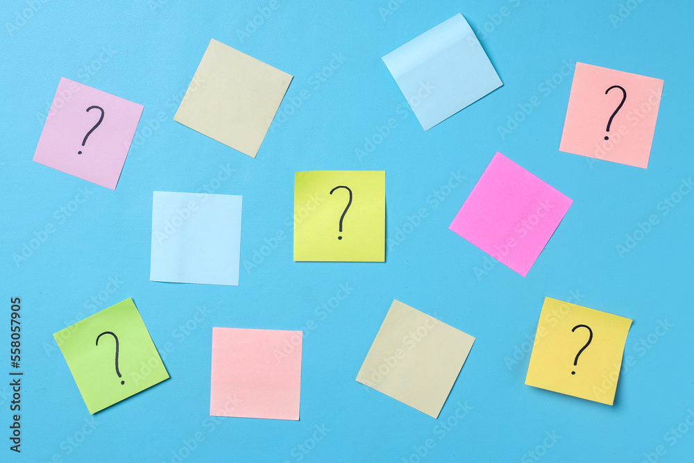 Question marks on sticky notes and colorful blank sticky notes for text ...