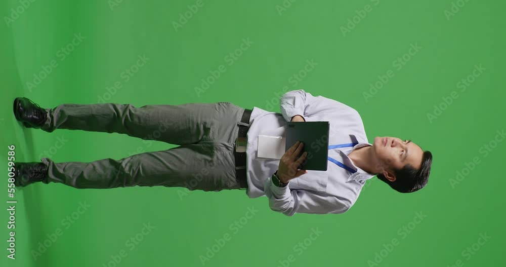 Full Body Of Asian Business Man Using Tablet An Looking Around On Green Screen Background In The Studio
Full Body Of Asian Business Man Using Tablet An Looking Around On Green Screen Background In The Studio