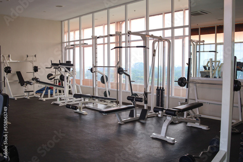 Modern of gym interior with equipment. Sports equipment in the gym.