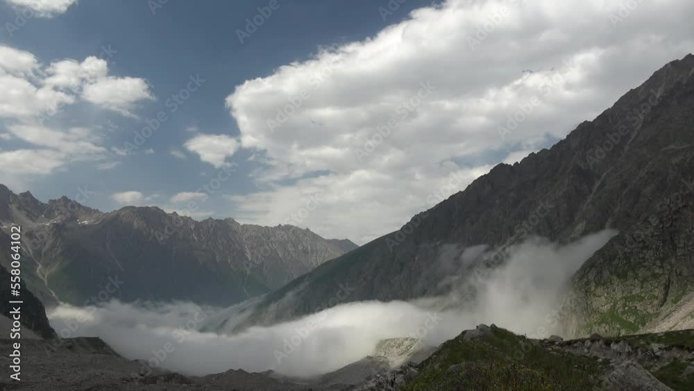Caucasus, Mizhergi gorge. Clouds in the valley.
