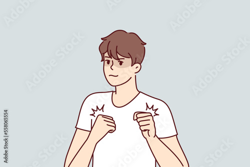 Brave man clenching fists holds hands in front of chest preparing for fight or self-defense. Young guy athlete with knowledge in martial arts in white T-shirt stands in boxers pose. Flat vector image