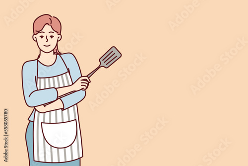 Smiling woman housewife stands with arms crossed in front of chest with spatula for cooking. Lady homemade confectioner or cook posing in striped apron draped over casual clothes. Flat vector image