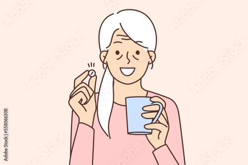 Smiling old woman have pill 